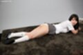 Iori sana lying on her front looking to the side skirt raised over panties