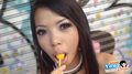 Sucking yellow lollipop long hair